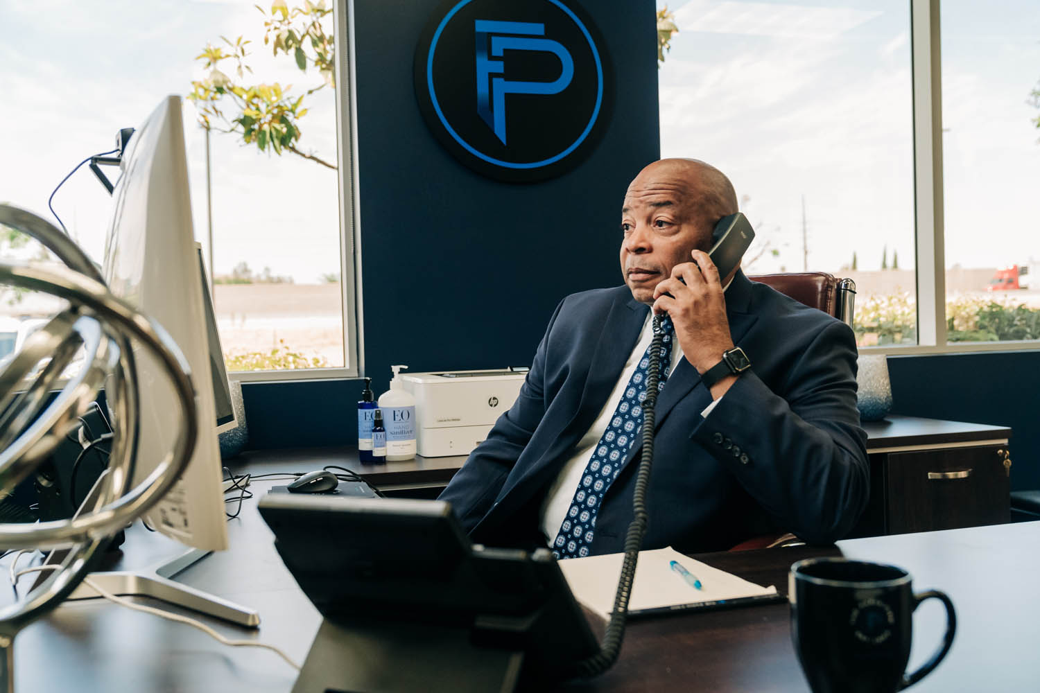 Attorney Eric Paris is taking a clients phone call Eric Paris is taking a clients phone call